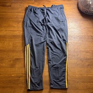 Adidas Men's Black Track Pants with Orange Stripes